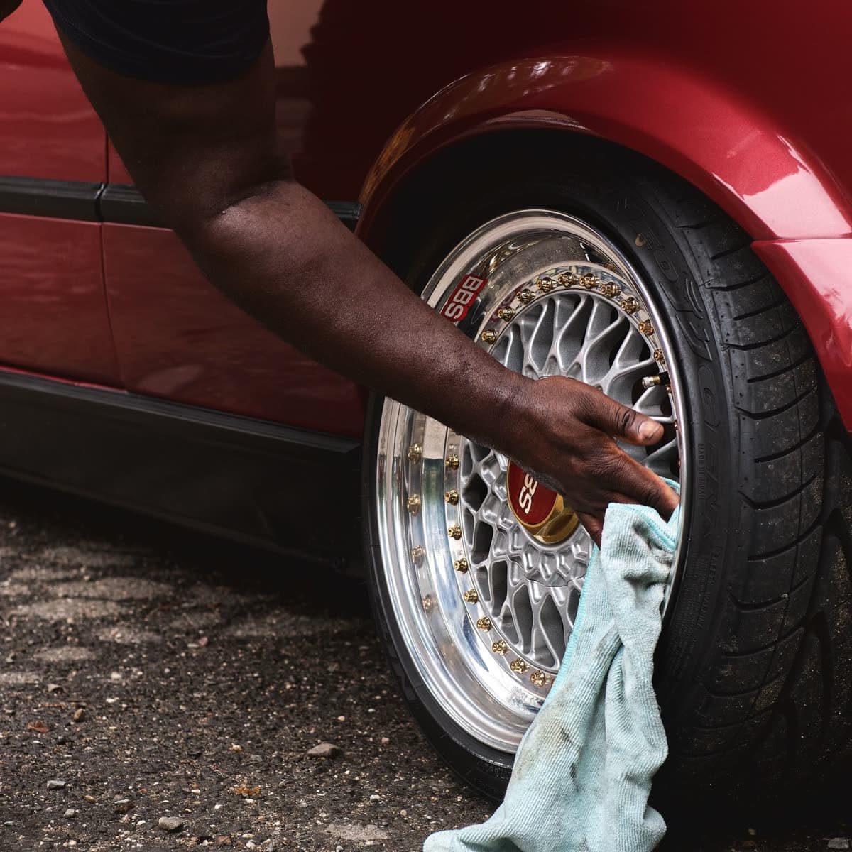 Wheel being decontaminated by hand