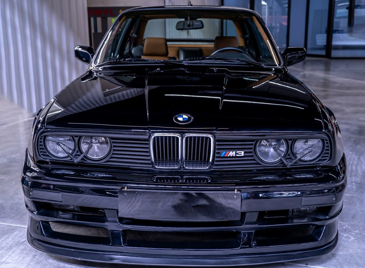 Black BMW E30 M3, front three-quarter